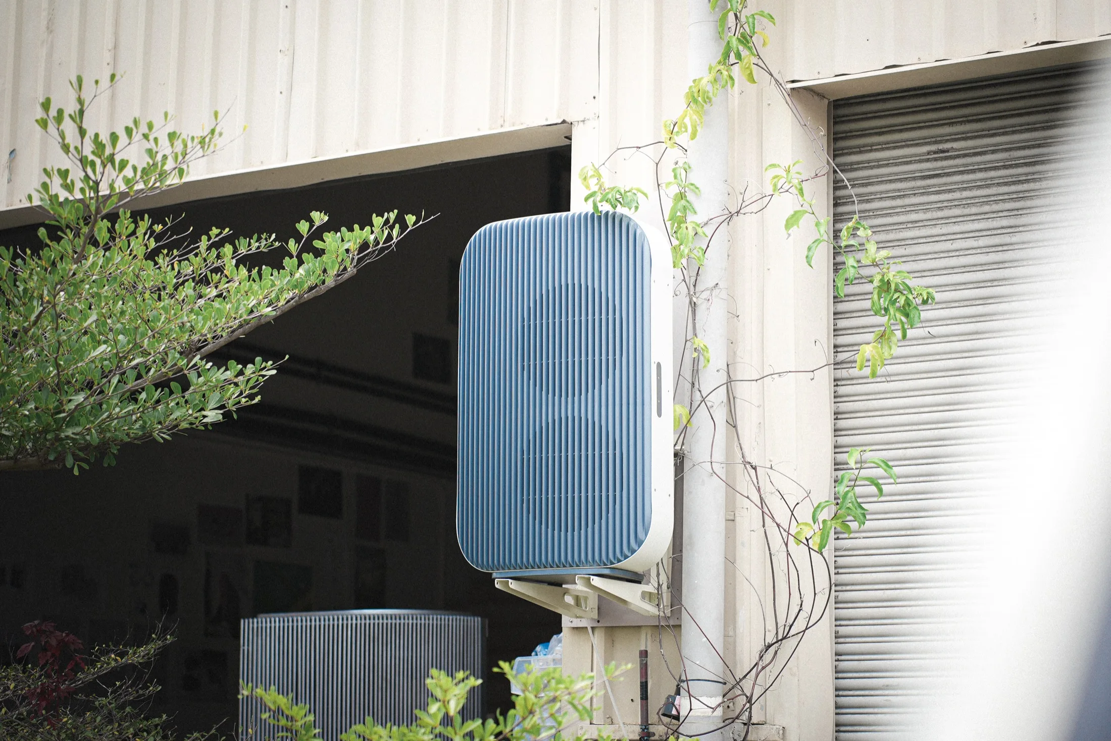 Airform outdoor unit mounted outside a workshop
