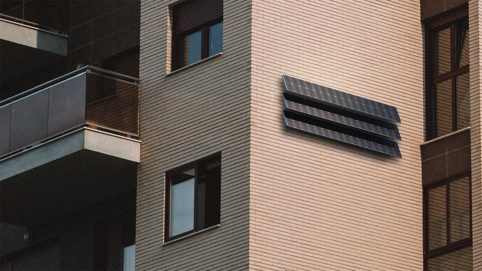 Airform Solo solar module — angled photovoltaic louvres on a brick facade